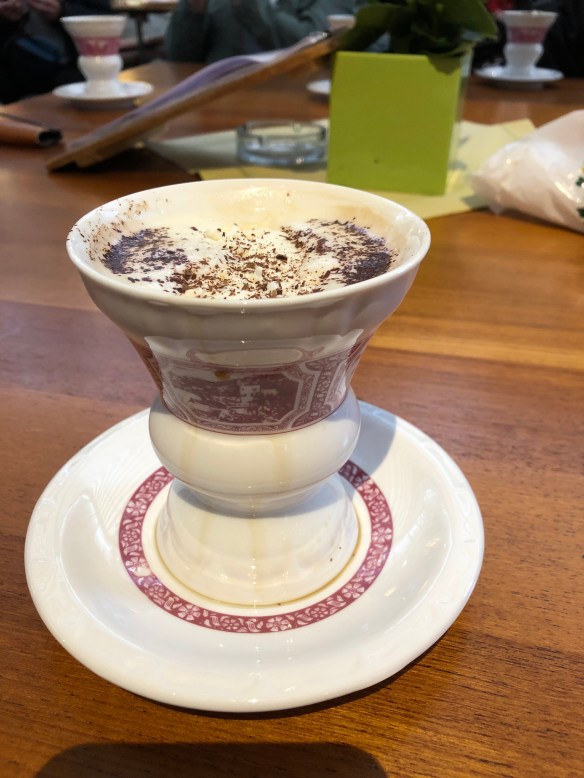 chocolate topped brandy and coffee in ornate cup